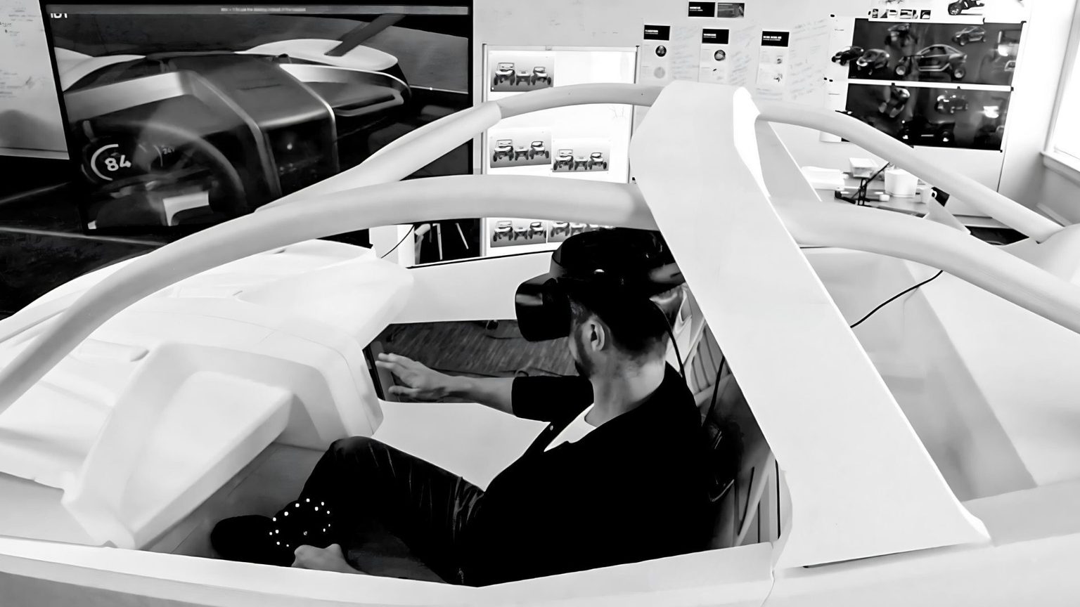 Man in mockup vehicle with VR headset on