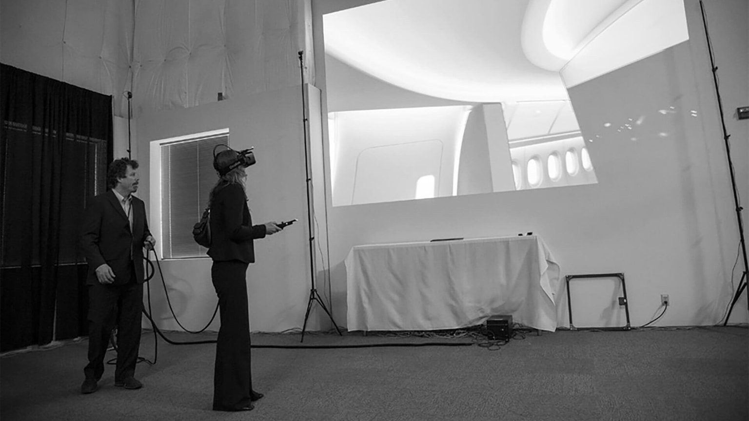 Women in VR headset looking at virtual airplane cabin design