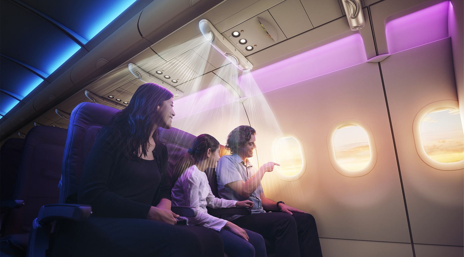 Three passengers seated on airplane under the AirShield cabin-air safety device