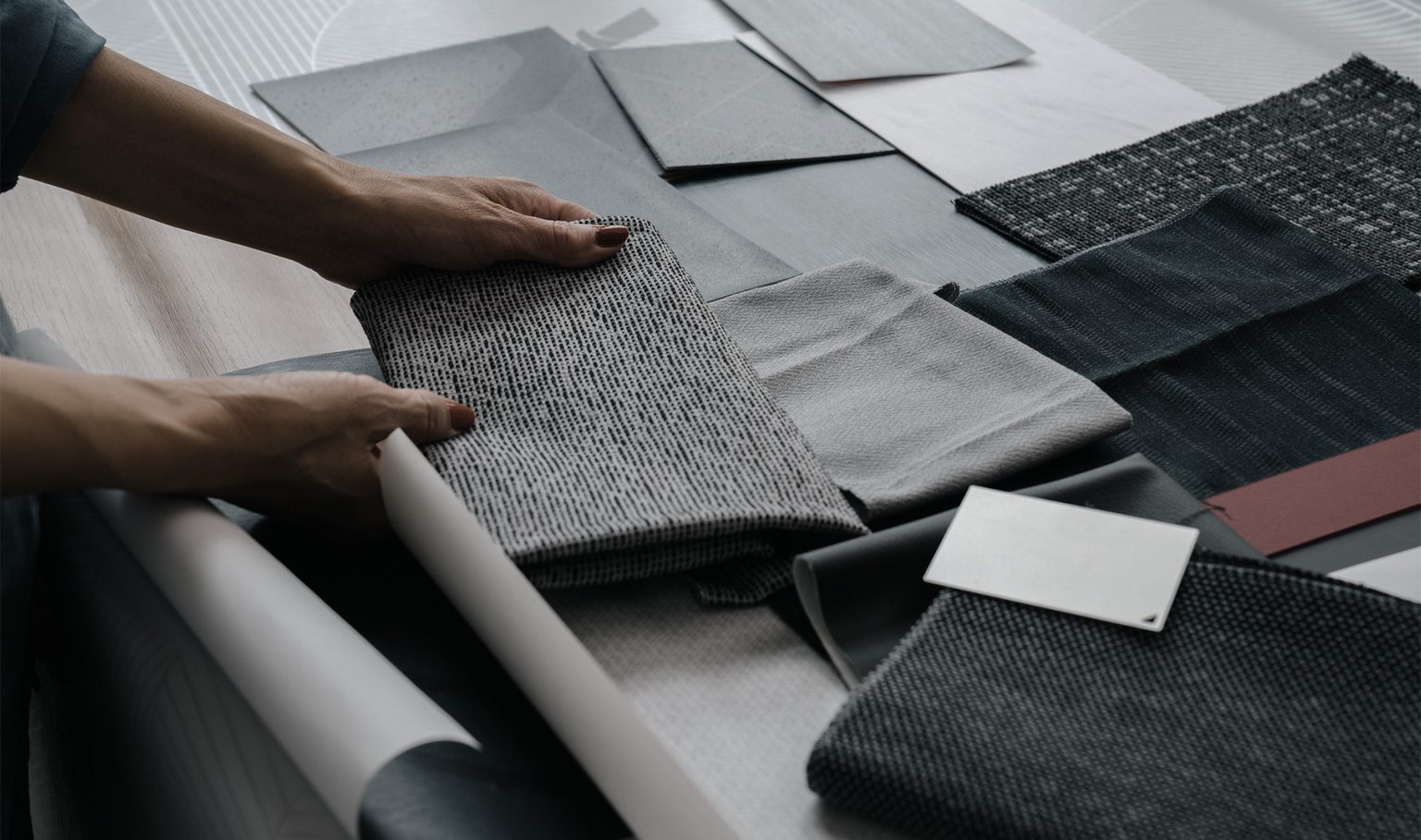 Women holding material samples