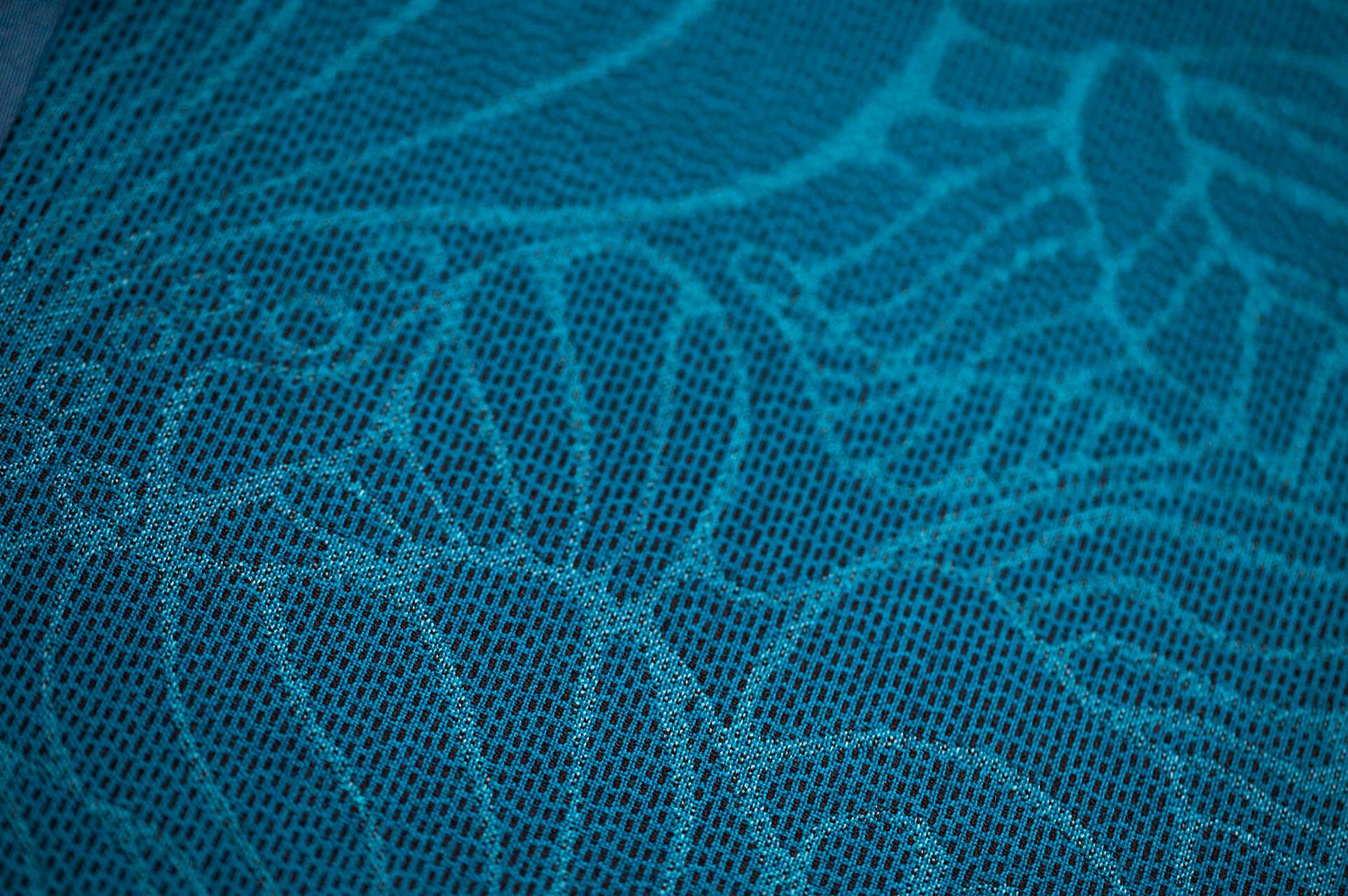 Hawaiian Airlines seat fabric with mid blue and turquoise flower line pattern motif