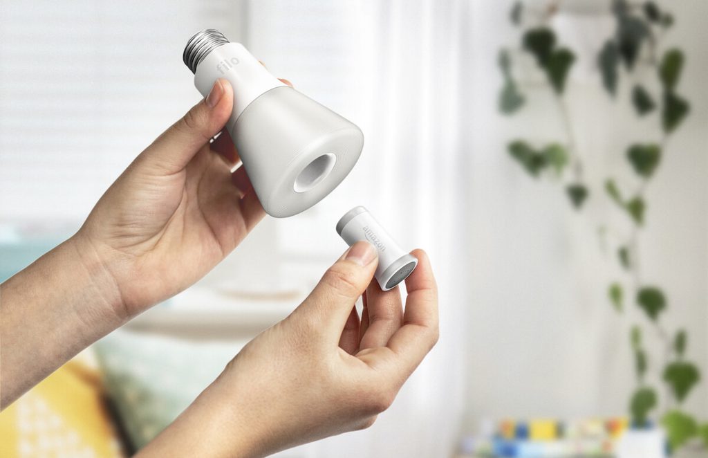 Hand inserting Filo lightbulb module