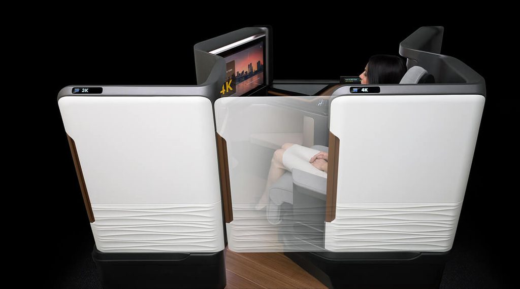 Women seating in Panasonic Waterfront suite with door closed watching a movie