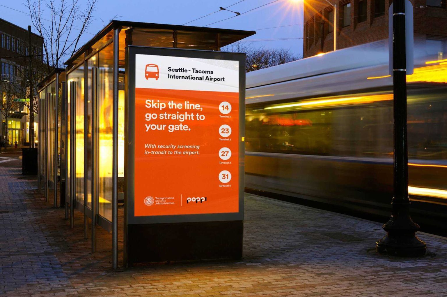 Signage adverting a baggage drop off point for people traveling through SeaTac airport