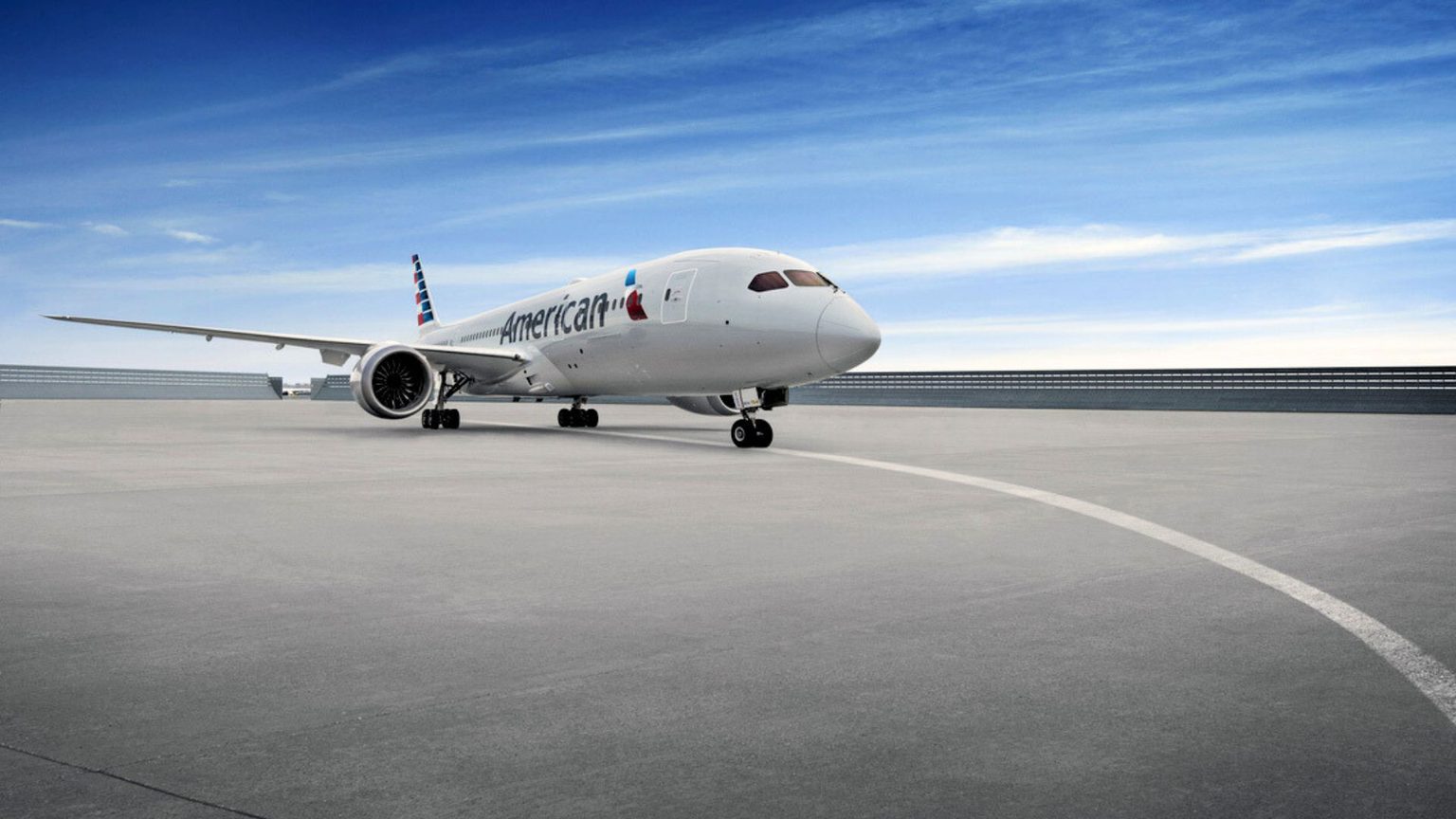 American Airlines jet with blue sky ub background