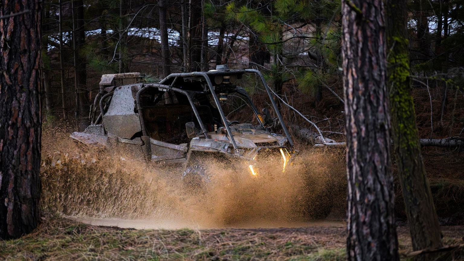 Autonomous military ATV drives through forest