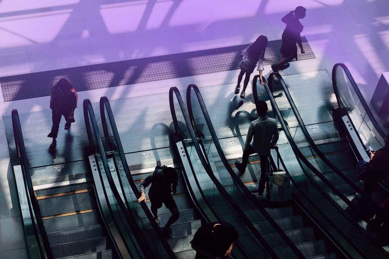 Aerial view of people on escalators